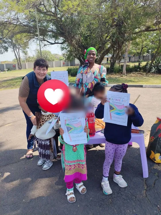 Children and teachers celebrating Heritage Day on the school grounds