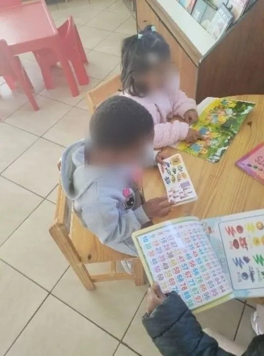 Children paging through number and picture books